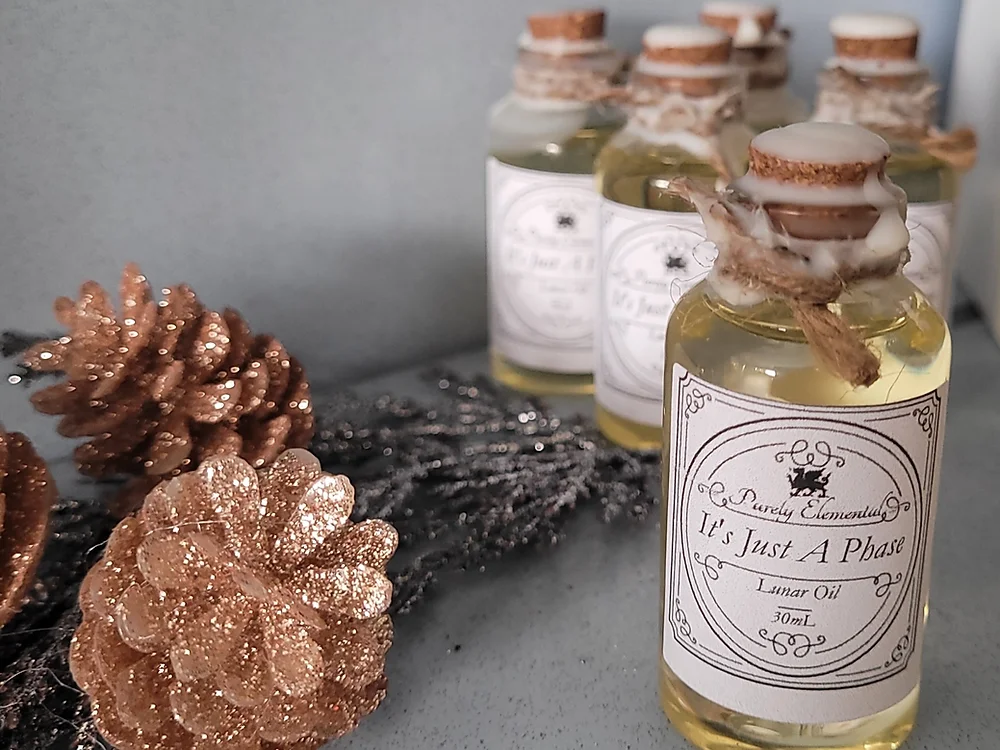 body oil jars with pinecones