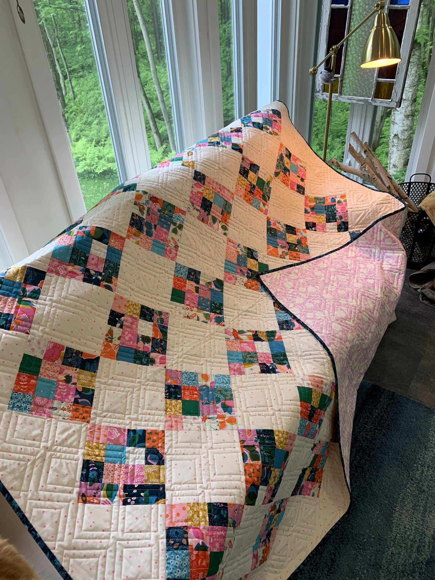 vibrant pink blue and white quilt 