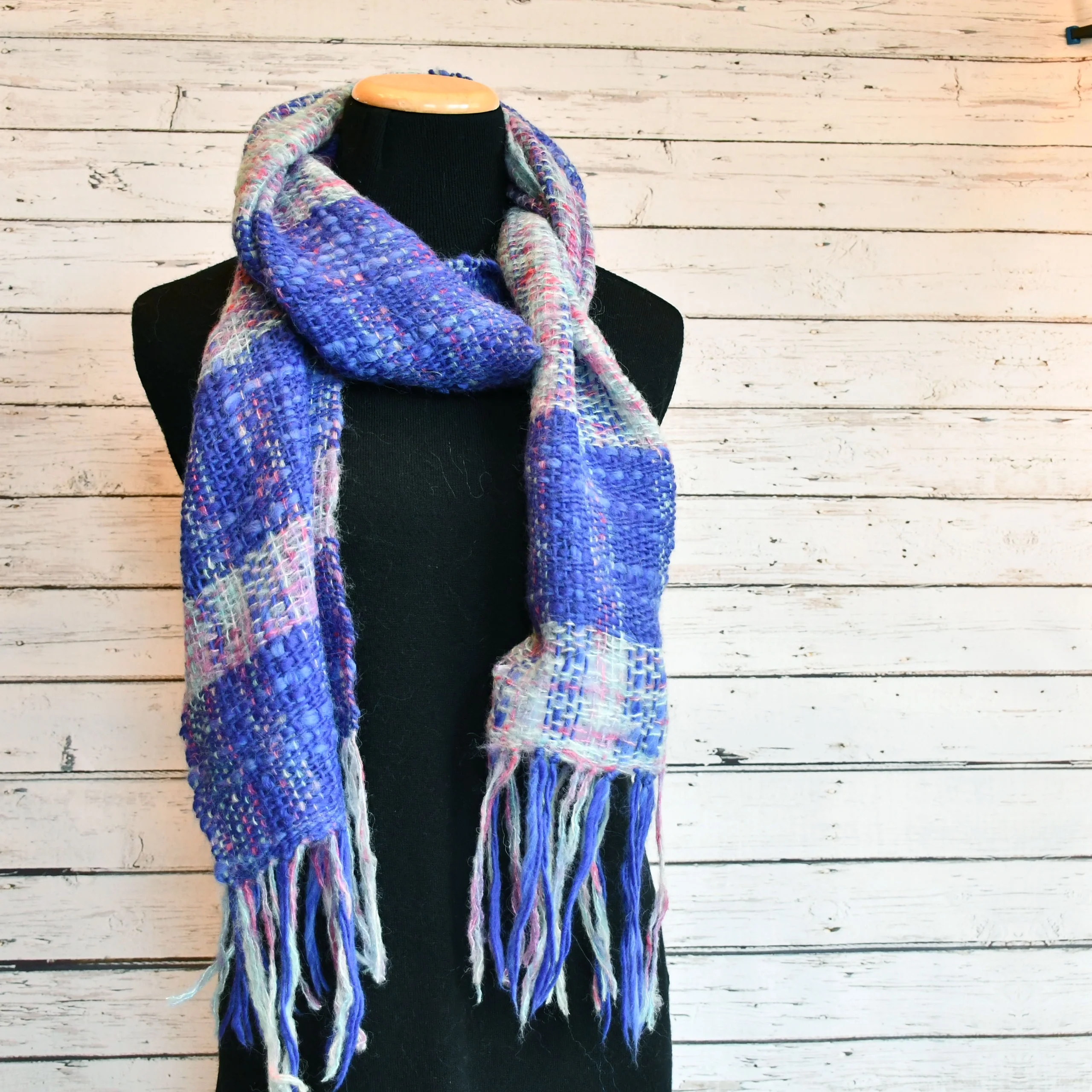 blue plaid scarf on black manikin 
