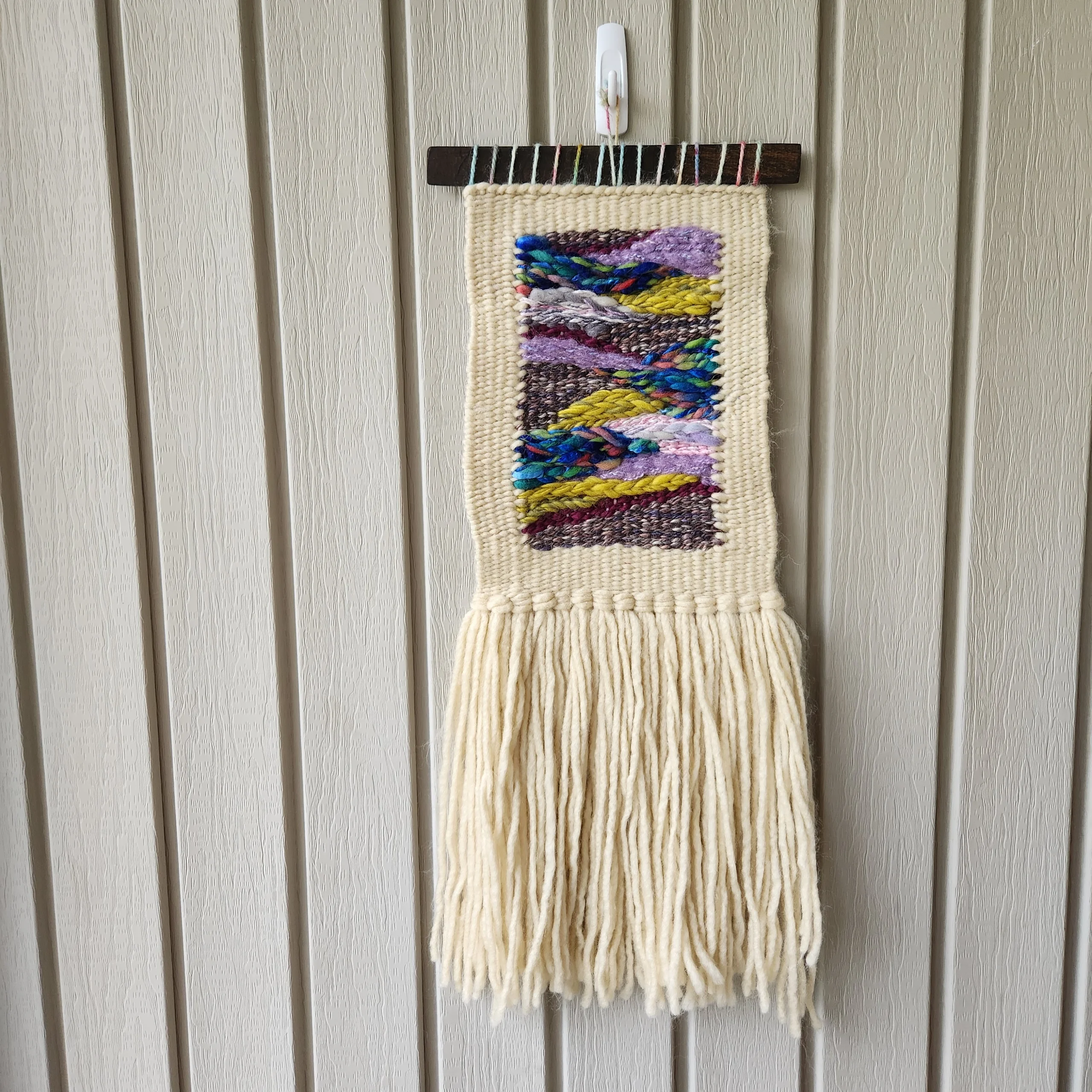 small woven tapestry wall art aprox 6 inch by 10 inches